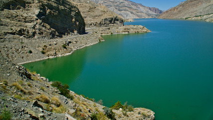 Fototapeta premium Erzurum, Tortum lake, cliff mountains and cloud reflection in water
