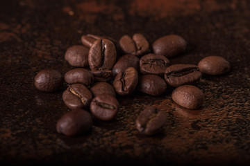 Coffee beans  on stone background. Top view with copy space for your text. Roasted coffee beans background. Beans texture, macro