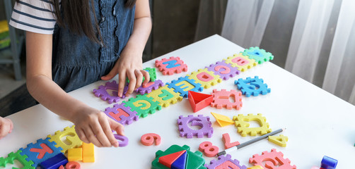 Asian Kids playing with puzzle, learning concept