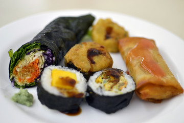 colored healthy vegetarian wrap in a white plate