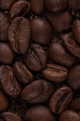 Coffee beans  on stone background. Top view with copy space for your text. Roasted coffee beans background. Beans texture, macro