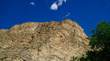 Fototapeta premium Curving roads in a green nature with pointed and steep rocks