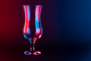 Smoothie Glass on a black background with a red and blue light