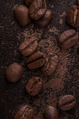 Coffee beans  on stone background. Top view with copy space for your text. Roasted coffee beans background. Beans texture, macro