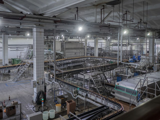 Equipment for making beer..Automatic Beer bottling line. modern brewery. production process of brewing. Beer production mode. Interior view of modern conveyor shop for bottling products