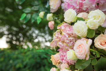 Wedding arch for ceremony outdoor with flower decoration and rustic design