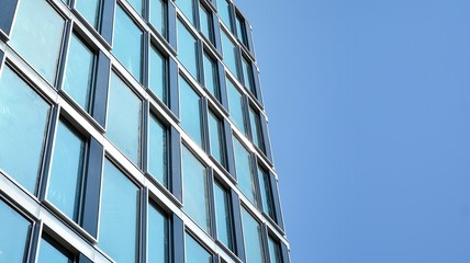  Modern office building with reflection in windows of building. New office building in the city center.