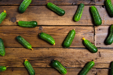 cucumbers vegetable on brown background, top view