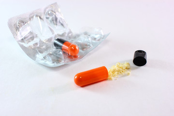 printed tablets package with light table background, one tablet