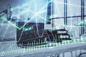 Forex graph hologram with desktop office computer background. Double exposure. Concept of financial analysis.