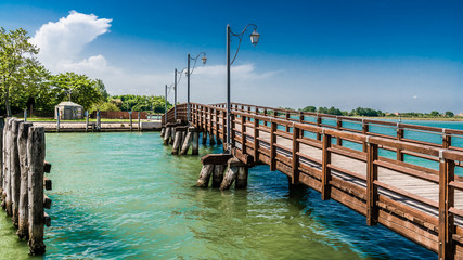 A wooden bridge connects the Islands