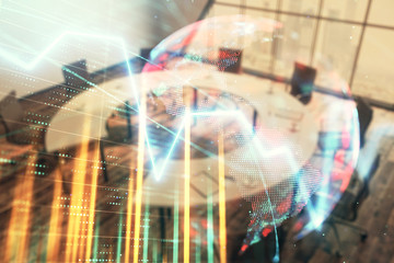 Double exposure of stock market graph with globe hologram on conference room background. Concept of international finance