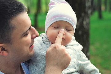 Сhild in dad's arms