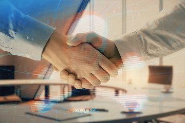 Double exposure of hacking theme hologram on office background with two men handshake. Concept of data security
