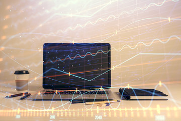 Forex graph hologram with desktop office computer background. Double exposure. Concept of financial analysis.