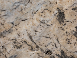 Selective focus at the center of old   granite rustic and rough stone with texture detail, Close-up, Abstract nature grungy background.
