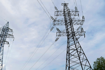 An electric pole holds wires. High voltage communication line. Electricity transmission, volt.