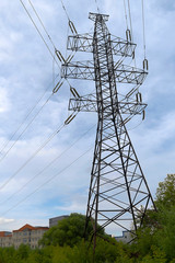 An electric pole transfers energy. High voltage line with wires. Electricity transmission, volt...