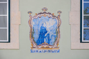 Saint Dominic (Santo Domingo), typical ceramic tile with blue and golden colors on a building in...