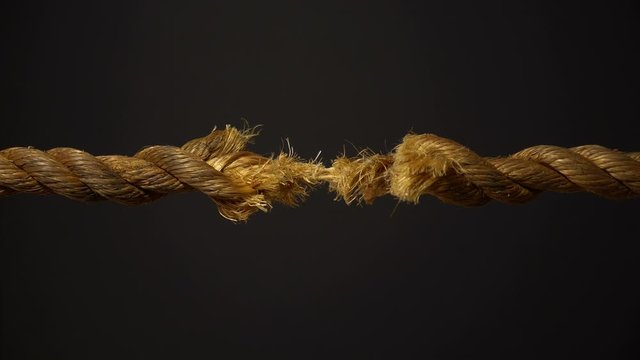 Frayed Rope and Thread on Black Background - Unlocking the Gold