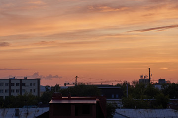 Fototapeta na wymiar Beautiful sunset over a provincial town, city at dusk
