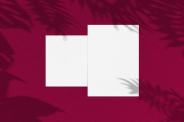 Blank white vertical paper sheet 5x7 inches with shadow overlay. Modern and stylish greeting card or wedding invitation mock up.