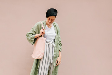 Young woman with eco bag enjoying morning. Eco friendly concept. .