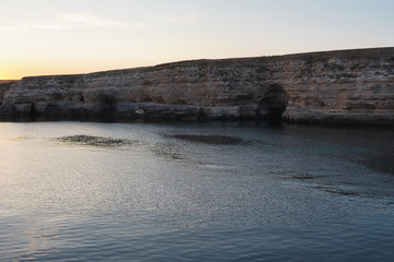 Sunset in the rocks on the sea