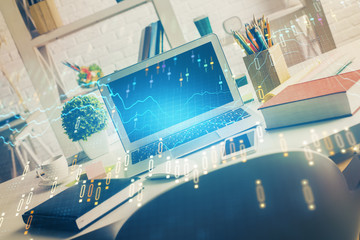 Financial graph colorful drawing and table with computer on background. Multi exposure. Concept of international markets.