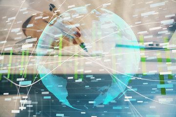 International business hologram over hands taking notes background. Concept of success. Multi exposure