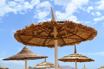 Beach sand umbrella on blue sky on Beach