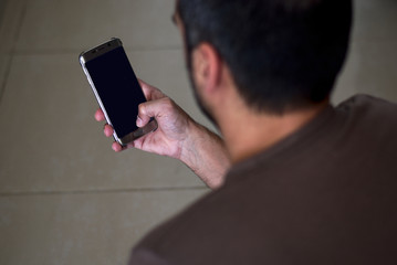 Young man using a cell phone.