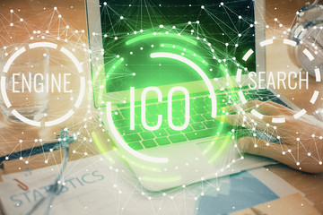 Blockchain theme hologram with man working on computer on background. Concept of crypto chain....