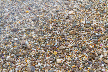 Sea stones on the seashore in the summer