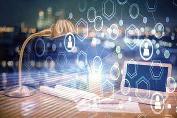 Computer on desktop with social network hologram. Double exposure. Concept of international people...