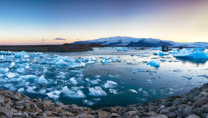 Beautifull landscape with floating icebergs in Jokulsarlon glacier lagoon at sunset