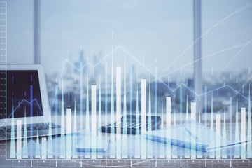 Forex graph hologram on table with computer background. Multi exposure. Concept of financial markets.