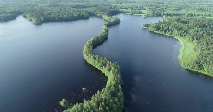 Aerial view of the beautiful lake at sunrise. Sun above the lake. Liesjarvi National Park. Finland. 