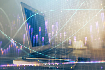 Forex market graph hologram and personal computer on background. Double exposure. Concept of investment.