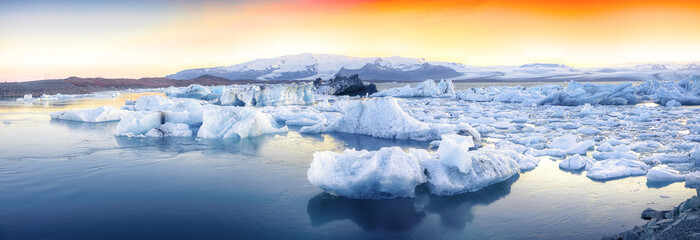 Beautifull landscape with floating icebergs in Jokulsarlon glacier lagoon at sunset - obrazy, fototapety, plakaty