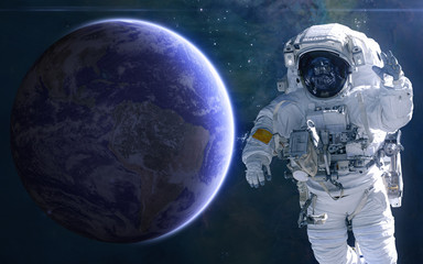 Earth and astronaut. Solar system. Science fiction. Elements of this image furnished by NASA