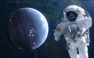 Uranus and astronaut. Solar system. Science fiction. Elements of this image furnished by NASA