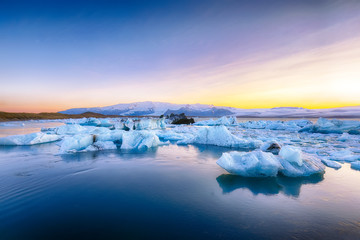 Beautifull landscape with floating icebergs in Jokulsarlon glacier lagoon at sunset