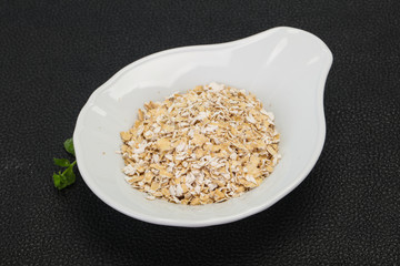 Raw oats in the bowl