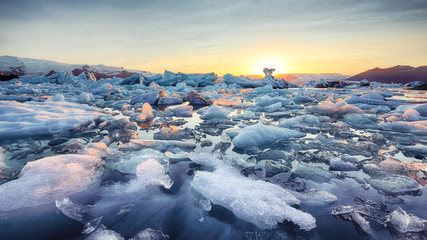 Beautifull landscape with floating icebergs in Jokulsarlon glacier lagoon at sunset