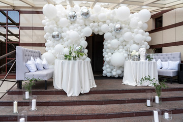 Wedding arch and chairs, photo zone of white balls
