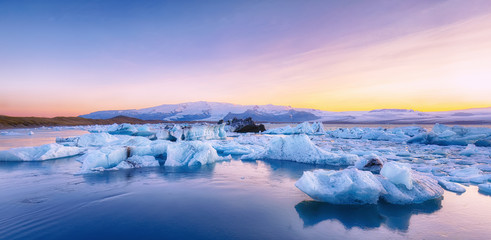 Beautifull landscape with floating icebergs in Jokulsarlon glacier lagoon at sunset