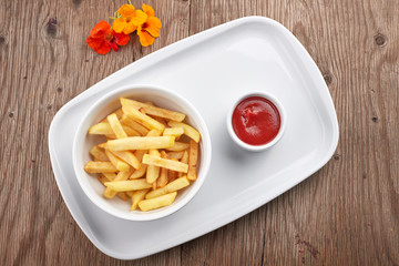 French fries with sauce on a white plate