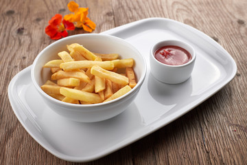 French fries with sauce on a white plate
