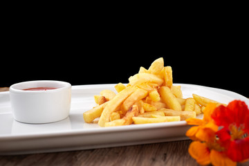 French fries with sauce on a white plate